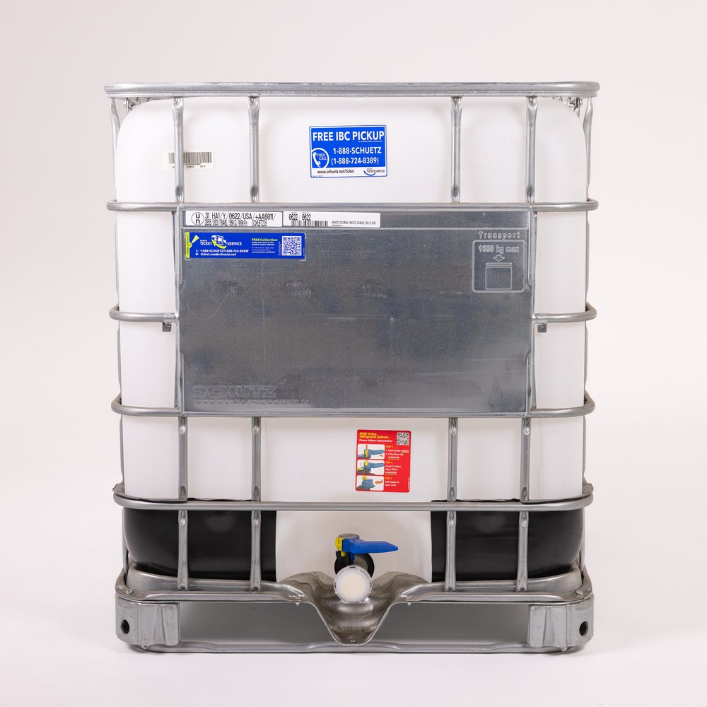 White IBC tote in a metal cage